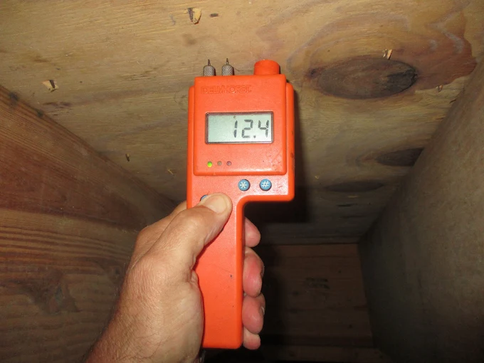 DocAir moisture meter reading during a building-science inspection